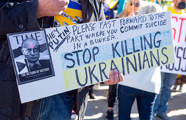 Santa Monica, California, USA - February 25, 2022: Stop Putin, stop war. Stand with Ukraine. Russia war against Ukraine, aggressive invasion. Ukrainians, Russians, Belarusians against Russia