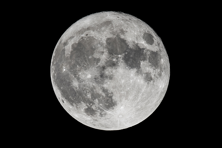 An amazing shot of the full moon on a dark night sky